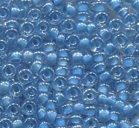 250 gr. 2,6mm Rocailles Klar mit Hellblaueinzug 38165