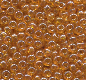 250 gr. 2,6mm Rocailles Orange-Topaz transparent Lüsternd 86060