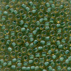 11/0 Roc. Turquoise Lined Topaz Luster 374